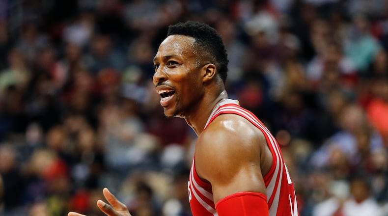 Houston Rockets center Dwight Howard (12) reacts after being called for a foul in the first half of an NBA basketball game against the Atlanta Hawks Saturday, March 19, 2016, in Atlanta. (AP Photo/John Bazemore)
