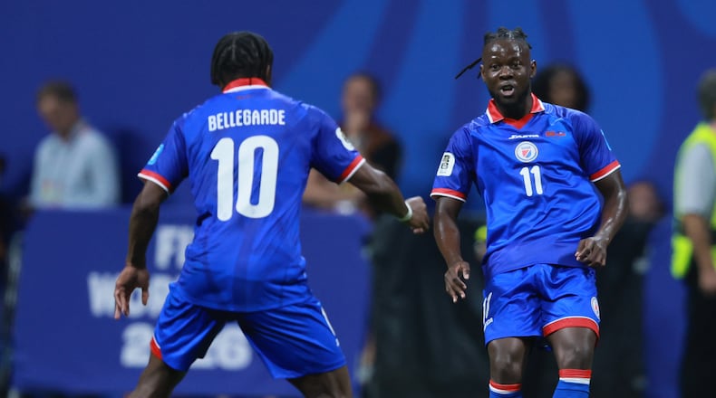 Haiti's Louicius Deedson, right, passes to teammate Jean-Ricner Bellegarde during second half of Morocco vs. Haiti Group C FIFA World Cup match at Atlanta Stadium (Mercedes-Benz Stadium) on Wednesday, June 24, 2026. (Jason Getz/AJC)