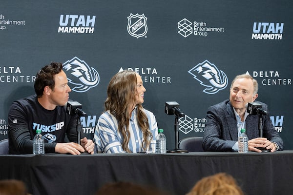 Chairman of Smith Entertainment Group Ryan Smith, Co-Founder Ashley Smith and NHL Commissioner Gary Bettman, from left, announce the Utah Mammoth as the new name and branding identity of Utahs NHL franchise, Wednesday, May 7, 2025, in Salt Lake City. (AP Photo/Melissa Majchrzak)