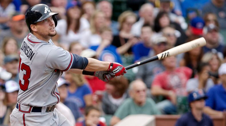 The Atlanta Braves' Chris Johnson hits a RBI single while playing the Chicago Cubs during the ninth inning of their National League MLB baseball game in Chicago, September 20, 2013.