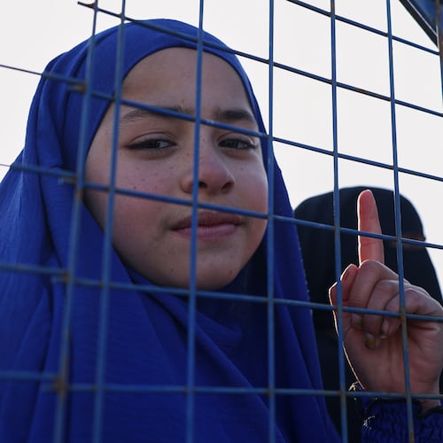 Sundus al-Hassan, 10, poses for a picture inside the al-Hol camp in northeastern Syria's Hasakeh province, Syria, Wednesday, Jan. 21, 2026, after the withdrawal of the Syrian Democratic Forces (SDF). (AP Photo/Ghaith Alsayed)