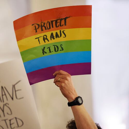 FILE - Protestors hold signs during a rally at the state capitol in Charleston, W.Va., on March 9, 2023. (AP Photo/Chris Jackson, file)