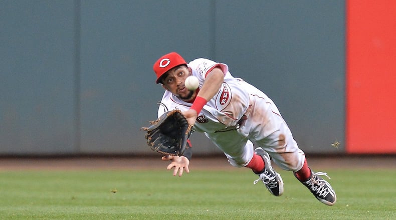 Billy Hamilton of the Cincinnati Reds makes a diving catch of a line drive on June 8, 2016 in Cincinnati, Ohio. (Photo by Jamie Sabau/Getty Images)