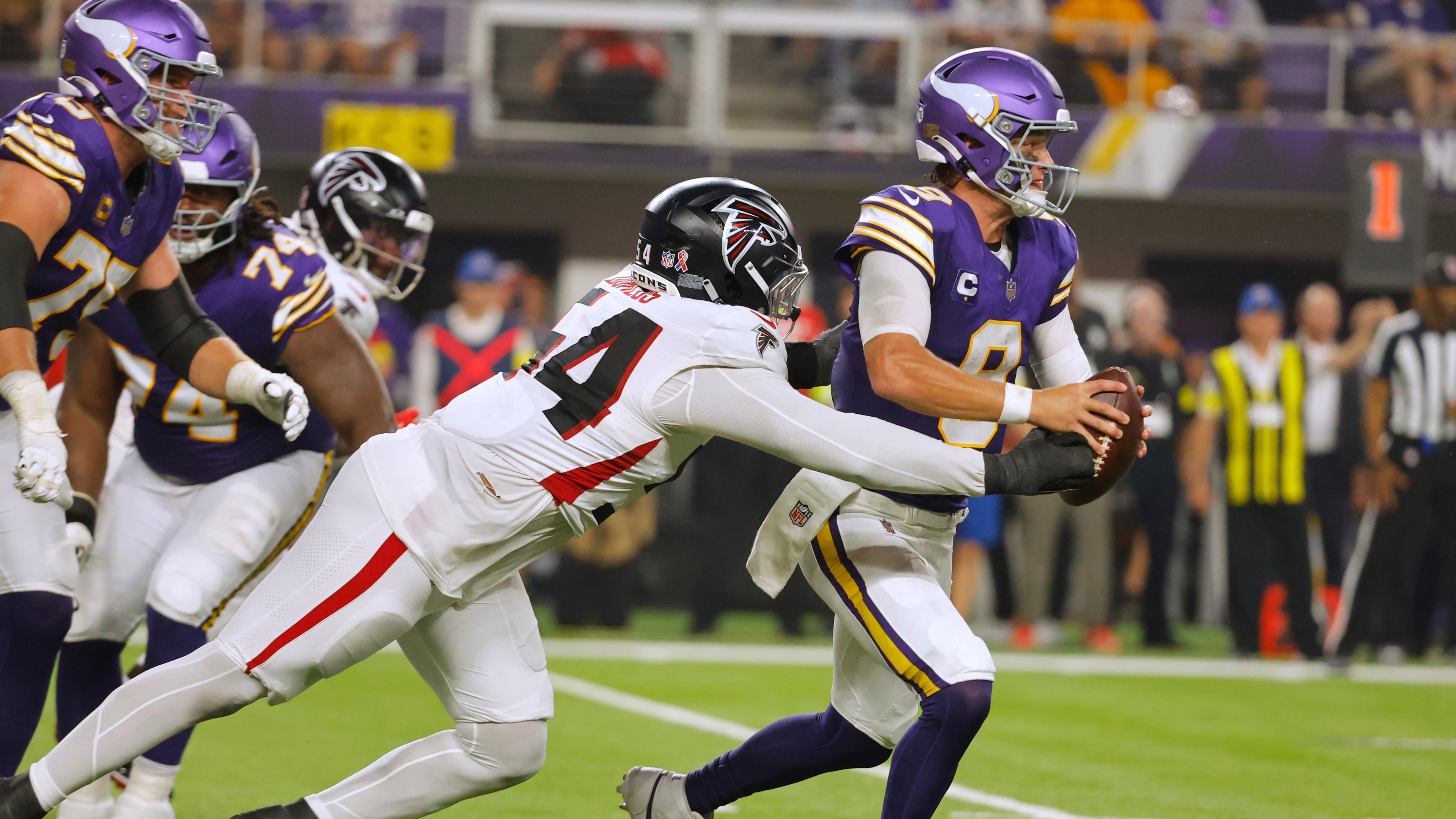 Atlanta Falcons defensive tackle Brandon Dorlus (54) sacks Minnesota Vikings quarterback J.J. McCarthy (9) during the first half of an NFL football game, Sunday, Sept. 14, 2025, in Minneapolis. (AP Photo/Bruce Kluckhohn)