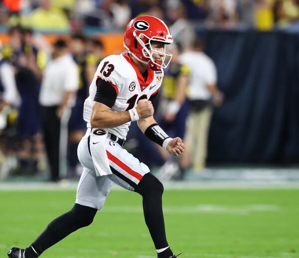 Georgia Bulldogs quarterback Stetson Bennett (13) celebrates. Curtis Compton / Curtis.Compton@ajc.com 