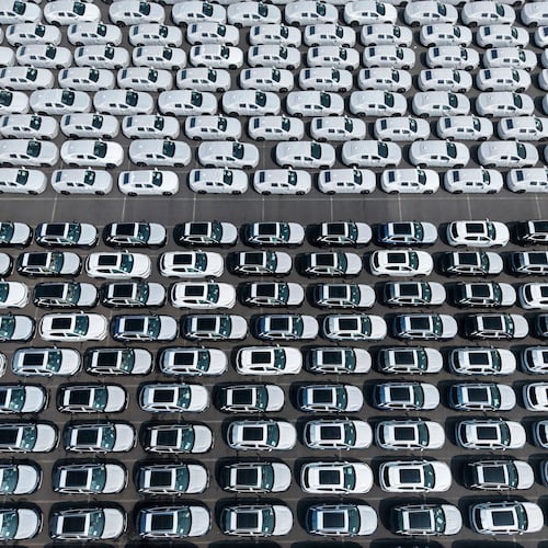 Aerial view of new vehicles waiting for shipment to overseas market at a port in Shanghai, China Saturday, May 9, 2026. (Chinatopix via AP)