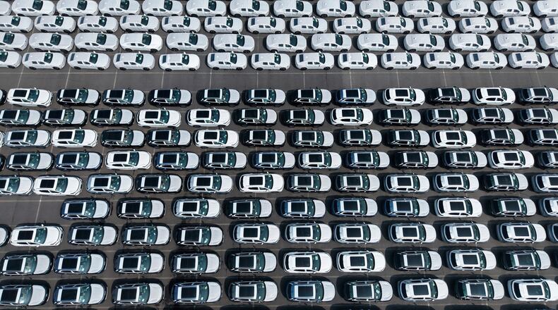 Aerial view of new vehicles waiting for shipment to overseas market at a port in Shanghai, China Saturday, May 9, 2026. (Chinatopix via AP)