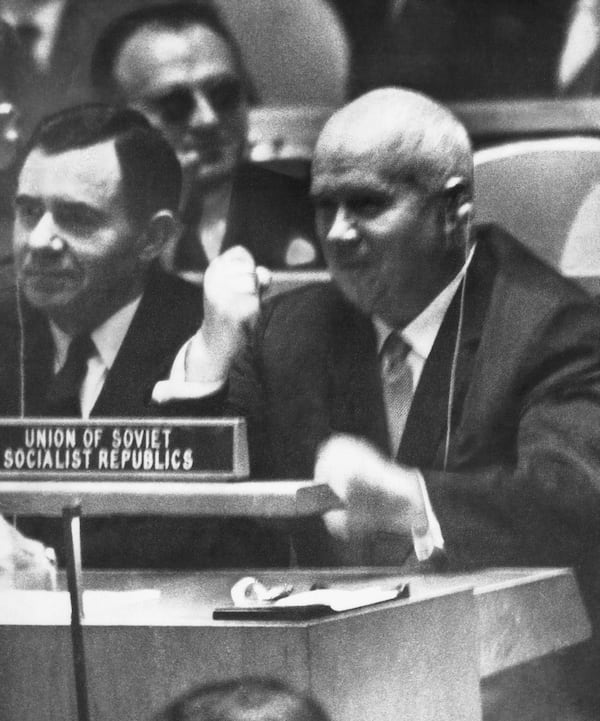 FILE - Soviet Premier Nikita Khrushchev pounds his desk with his fist at the United Nations, Oct. 12, 1960, during angry debate, as his wrist watch is on the desk in front of him. (AP Photo, File)