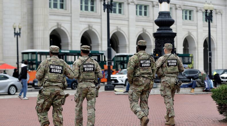 National Guard soldiers patrol at Union Station, Tuesday, Oct. 28, 2025, in Washington. (AP Photo/Rahmat Gul)