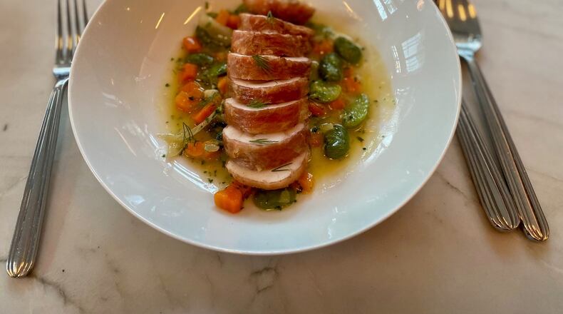 What makes Lucian’s monkfish with favas, fennel and carrots so extraordinary is that it’s encased in a thin sheath of speck. Wendell Brock for The Atlanta Journal-Constitution