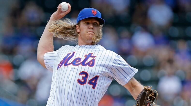 In this June 22, 2016, file photo, New York Mets starting pitcher Noah Syndergaard (34) delivers during the first inning of an interleague baseball game against the Kansas City Royals, in New York. With all those 100 mph fastballs flying through the strike zone these days from Aroldis Chapman, Noah Syndergaard and others, flame-throwers are the norm rather than the exception — in rotations and bullpens alike. (AP Photo/Kathy Willens, File)