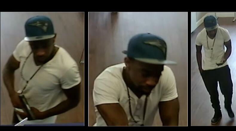 Gwinnett County police are looking for a man suspected of robbing a Metro PCS store at gunpoint.