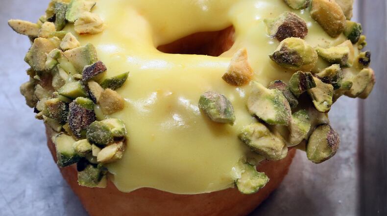 Vegan Orange Pistachio doughnut from Revolution Doughnuts. / AJC file photo
