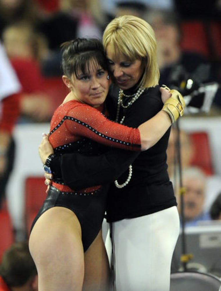 Gym Dogs win in coach's last home meet