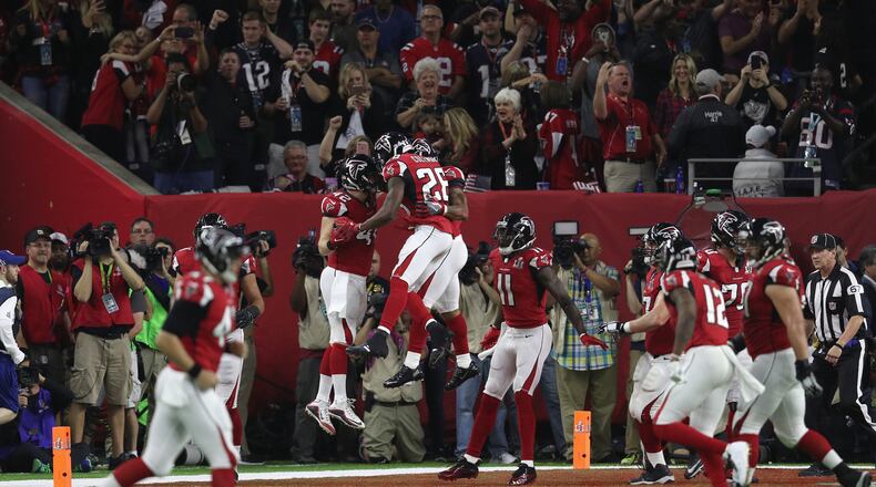 Devonta Freeman #24 of the Atlanta Falcons celebrates a 5-yard touchdown in the second quarter with teammates against the New England Patriots during Super Bowl 51 at NRG Stadium on February 5, 2017 in Houston, Texas. (Photo by Patrick Smith/Getty Images)
