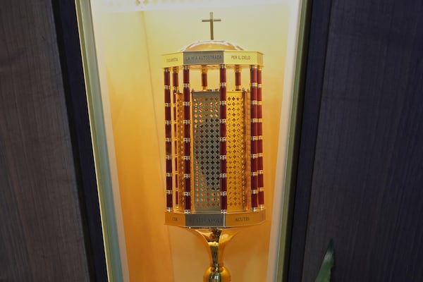 The heart relic of Carlo Acutis, the 15-year-old Italian boy who died in 2006 of leukemia and beatified in 2020 is shown at the San Rufino Cathedral in Assisi, Italy, Wednesday, April 2, 2025. (AP Photo/Alessandra Tarantino)