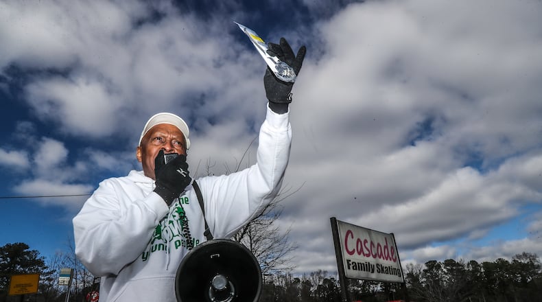 January 23, 2023 ATLANTA: Jack Logan founder of Put Down the Guns Now Young People Organization from Greenville, South Carolina stands in front of the parking lot of Cascade Family Skating located at at 3351 Martin Luther King Jr. Drive on Monday, Jan. 23, 2023 giving away free gun locks where a 13-year old was shot to death over the weekend. Separate shootings across Atlanta on Saturday claimed the lives of two people, including a 13-year-old boy who was leaving a skating rink, according to authorities. Around 11:30 p.m., Atlanta police were called to a parking lot at 3351 Martin Luther King Jr. Drive, just outside the Perimeter in the Adamsville neighborhood of southwest Atlanta. The lot is home to a Popeyes restaurant and a DominoÕs Pizza. There, they found a 13-year-old boy with multiple gunshot wounds, according to police. He was taken to Grady Memorial Hospital, where he was pronounced dead. He was identified by the Fulton County Medical ExaminerÕs Office as Deshon Dubose. Investigators believe he was with a group of teenagers who were at the Cascade Family Skating rink prior to the shooting. The rink is located just behind the lot where Dubose was shot, police said. No other details have been released by police. (John Spink / John.Spink@ajc.com)