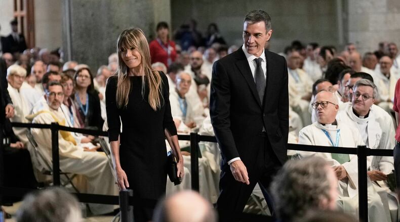 Spain's Prime Minister Pedro Sanchez and his wife Begona Gomez arrive before a Mass celebrated by Pope Leo XIV at the Basilica of the Sagrada Familia in Barcelona, Spain, Wednesday, June 10, 2026. (AP Photo/Bernat Armangue)