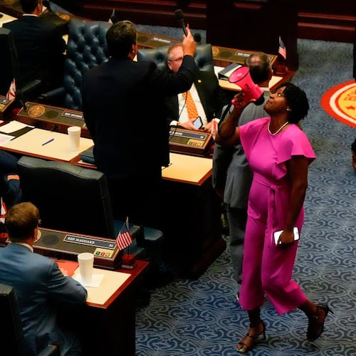 FILE - State Rep. Angie Nixon, D-Fla., speaks loudly on the House floor as the House votes on HB1D, a redistricting bill, during a special session of the Florida Legislature, April 29, 2026, in Tallahassee, Fla. (AP Photo/Mike Stewart, File)