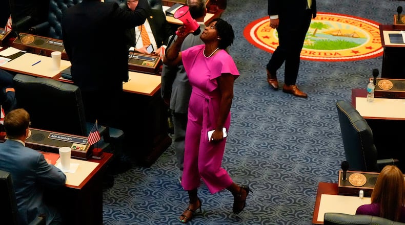 FILE - State Rep. Angie Nixon, D-Fla., speaks loudly on the House floor as the House votes on HB1D, a redistricting bill, during a special session of the Florida Legislature, April 29, 2026, in Tallahassee, Fla. (AP Photo/Mike Stewart, File)