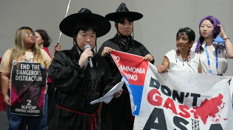Activists participate in a demonstration calling for South Korea to stop funding fossil fuels during a Don't Gas Asia protest at the COP30 U.N. Climate Summit, Monday, Nov. 17, 2025, in Belem, Brazil. (AP Photo/Andre Penner)