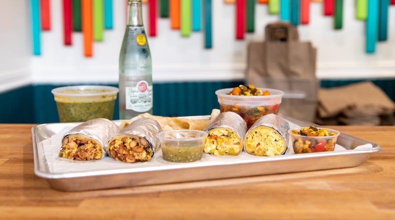 Poco Loco burritos, fresh house tortillas, marinated tomato and corn salsa, and chimichurri. (Mia Yakel for The Atlanta Journal-Constitution)
