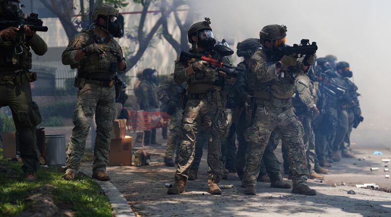 FILE - Law enforcement respond to protesters after federal immigration authorities conducted operations, June 7, 2025, in Paramount, Calif. (AP Photo/Eric Thayer, File)