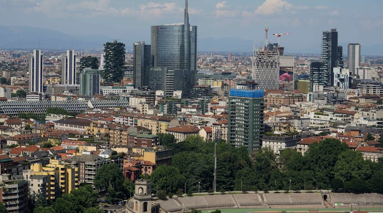 FILE — This photo shows Milan's CityLife district, including the city's tallest buildings, towering over housing architecture on June 26, 2021. (AP Photo/Luca Bruno, File)
