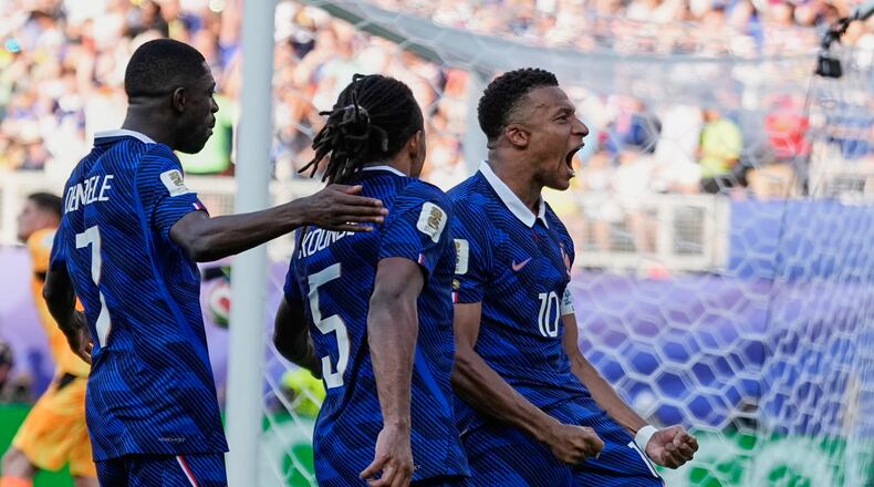 France's Kylian Mbappe celebrates after scoring from the penalty spot the opening goal during the World Cup round of 16 soccer match between Paraguay and France in Philadelphia, Saturday, July 4, 2026. (AP Photo/Matt Slocum)