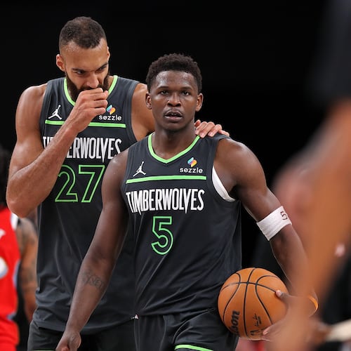Anthony Edwards (right) and Rudy Gobert of the Minnesota Timberwolves speak during the second half against the Memphis Grizzlies at FedExForum on Thursday, April 10, 2025, in Memphis, Tenn. (Justin Ford/Getty Images/TNS)