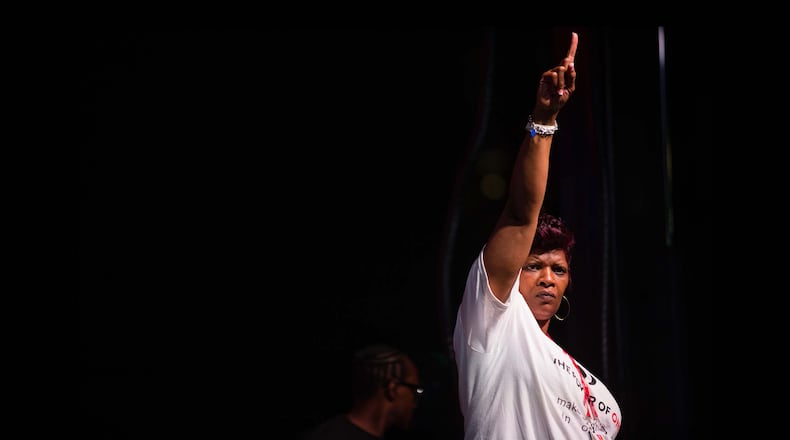Dorsey Jones, a survivor of child sex trafficking, speaks during  the Rotary International Convention 2017 Candlelight Vigil to End Slavery and Human Trafficking at Centennial Olympic Park.
