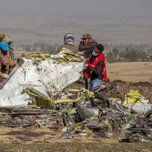FILE - In this March 11, 2019, file photo, rescuers work at the scene of an Ethiopian Airlines flight crash near Bishoftu, Ethiopia. Pilot Bernd Kai von Hoesslin pleaded with his bosses for more training on the Boeing Max, just weeks before the Ethiopian Airline's jet crashed, killing everyone on board. (AP Photo/Mulugeta Ayene, File)