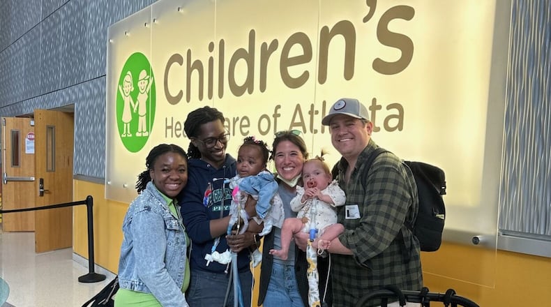 From left, Love, Teddy and Royal Dacius and Torri, Wynnie and Alex Deason during Royal’s discharge from Scottish Rite Hospital in Sandy Springs.