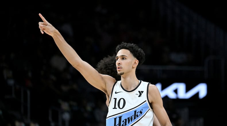 Atlanta Hawks forward Zaccharie Risacher (10) reacts after scoring during the first half in an NBA basketball game at State Farm Arena, Friday, February 7, 2025, in Atlanta. (Hyosub Shin / AJC)