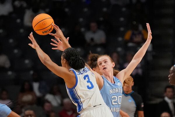 Duke guard Ashlon Jackson (3) passes around North Carolina guard Lexi Donarski (20) during the first half in the Sweet 16 of the NCAA college basketball tournament, Friday, March 28, 2025, in Birmingham, Ala. (AP Photo/Gerald Herbert)