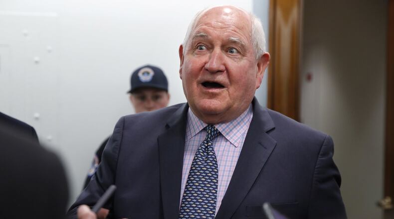 In this April 11, 2018, file photo, Agriculture Secretary Sonny Perdue speaks with reporters on Capitol Hill in Washington. The Trump administration is setting out to accomplish what this year’s farm bill didn’t: Tighten work requirements for millions of Americans who receive federal food assistance. (AP Photo/Jacquelyn Martin, File)