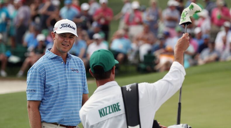 Patton Kizzire consults with his caddie during the first round of the Masters Tournament Thursday, April 11, 2019, at Augusta National Golf Club in Augusta. Jason Getz / Special to the AJC