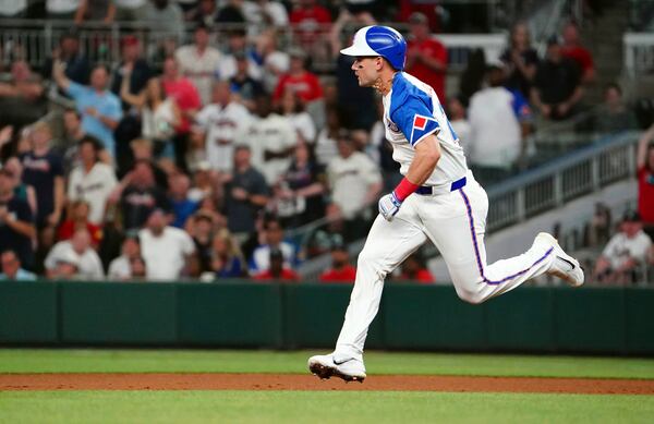 Atlanta Braves outfielder Jarred Kelenic (24) runs the bases against the Minnesota Twins trying to get to second base during the sixth inning in a baseball game at Truist Park, Saturday, April 19, 2025, in Atlanta. (AP Photo/ John David Mercer)