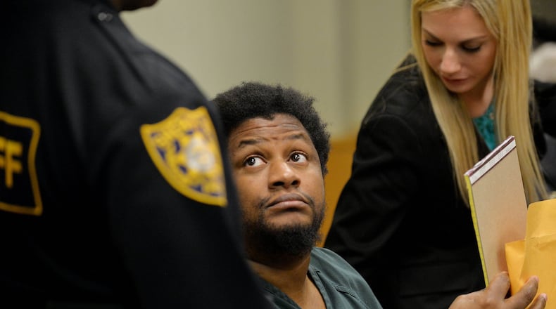 DECEMBER 5, 2014 LAWRENCEVILLE Calvin Mcintosh looks towards a deputy for instructions after being bound over for trial in 2014. Mcintosh and his daughter are charged with starving the man’s child to death and withholding food from the child’s 21-year-old mother, who weighed 59 pounds when she was found. KENT D. JOHNSON/KDJOHNSON@AJC.COM