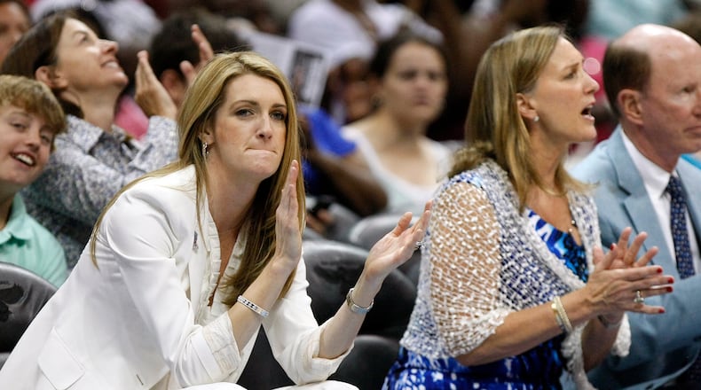 110605 Atlanta - The newly expanded Dream ownership group now includes Kelly Loeffler, left, and Mary Brock, right, cheering their team in 2nd half action against New York at Philips Arena in Atlanta on Sunday, June 5, 2011. Curtis Compton ccompton@ajc.com