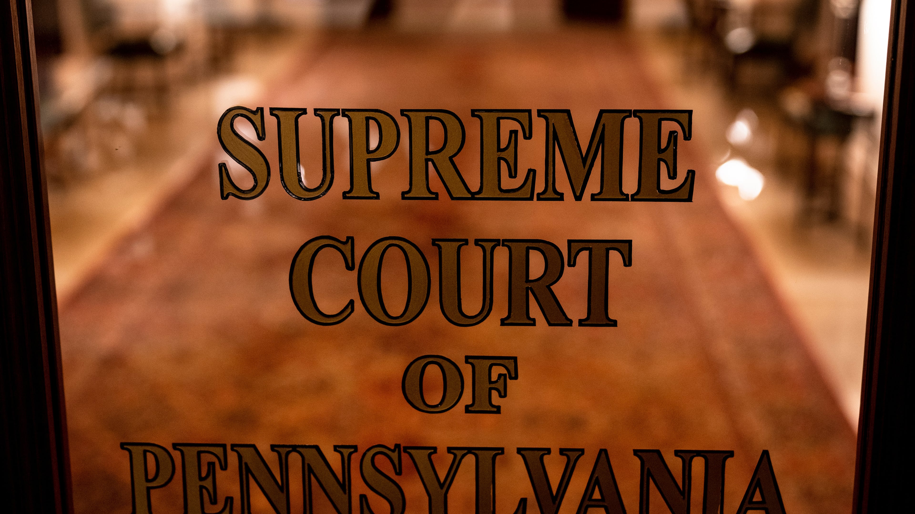FILE - A sign on a door at The Supreme Court of Pennsylvania is pictured at the Capitol in Harrisburg, Pa., Feb. 21, 2023. (AP Photo/Matt Rourke, File)