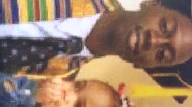 Deaundre Phillips, 24, pictured with his daughter, was shot dead last Thursday outside an Atlanta Police Department annex. (Family photo)