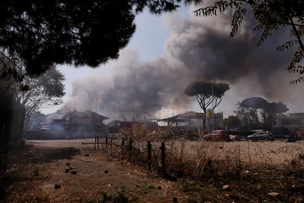 Smoke rises after a gas station exploded on the outskirts of Rome, Friday, July 4, 2025. (Cecilia Fabiano/LaPresse via AP)