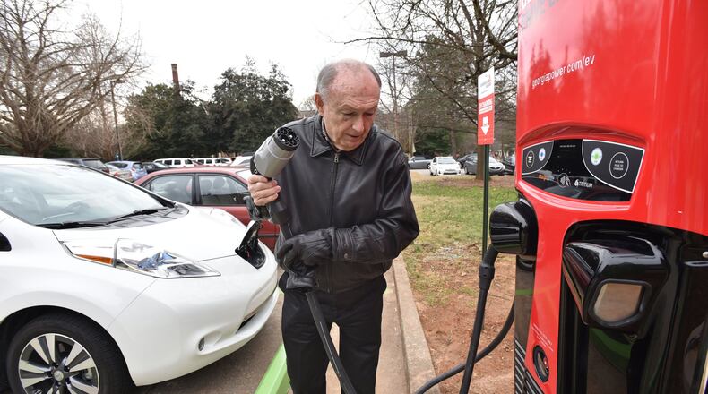 Don Francis, executive director of Clean Cities Georgia, charges his electric vehicle using DC Fast Charging station at Agnes Scott College, in this file photo from January 2016. Francis is hoping lawmakers will take another look at incentives for electric cars, perhaps with a break on sales tax. HYOSUB SHIN / HSHIN@AJC.COM