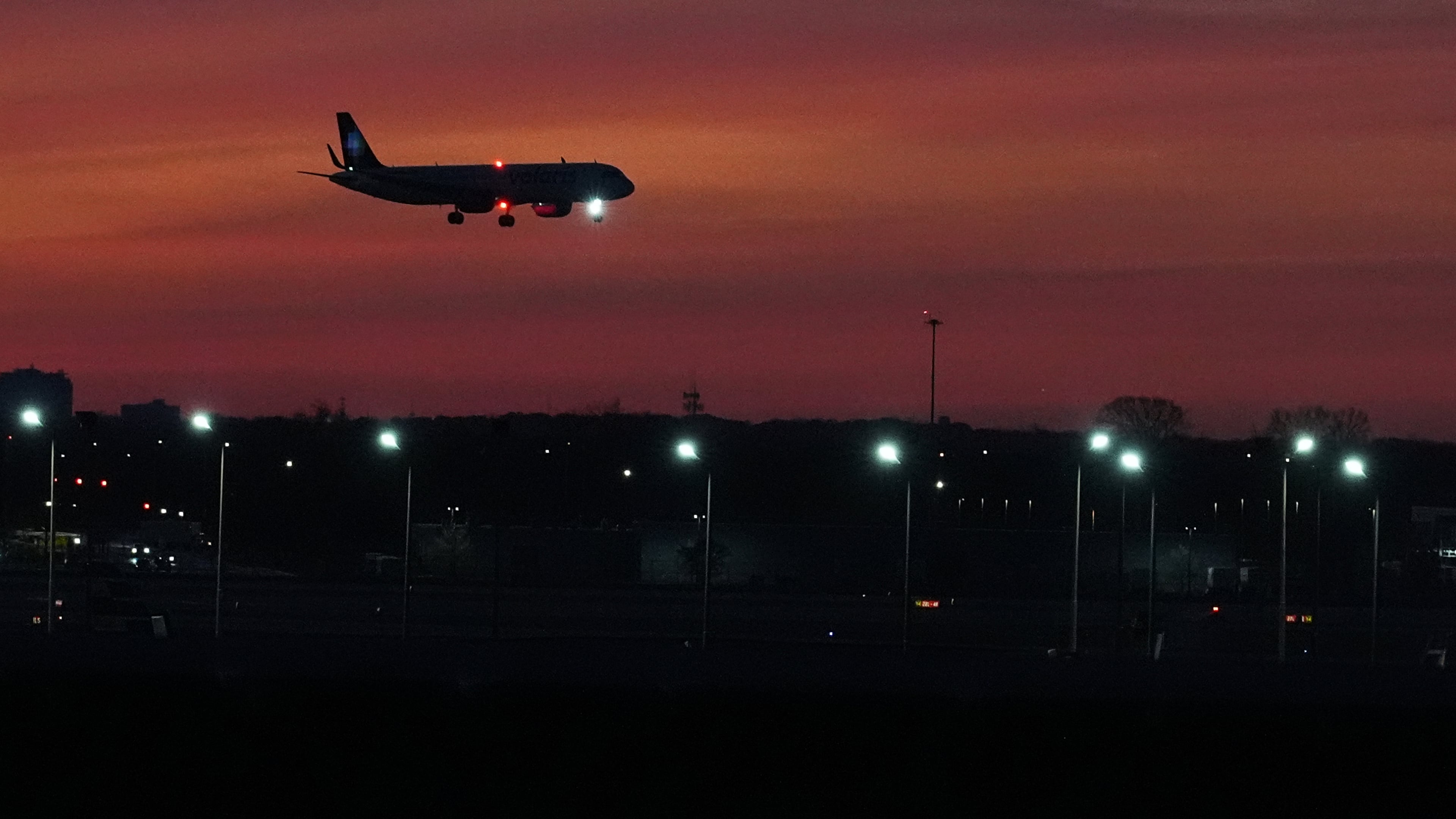 An airplane prepares to land at O'Hare International Airport, in Chicago, Wednesday, Nov. 12, 2025. (AP Photo/Nam Y. Huh)