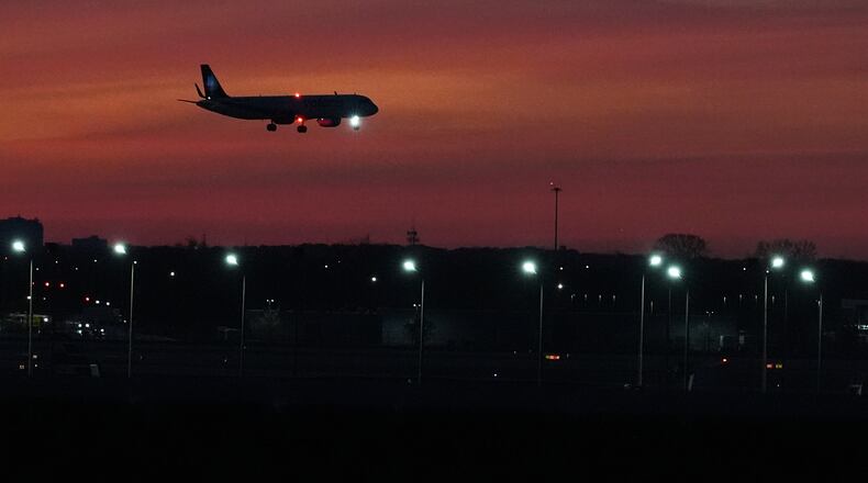 An airplane prepares to land at O'Hare International Airport, in Chicago, Wednesday, Nov. 12, 2025. (AP Photo/Nam Y. Huh)