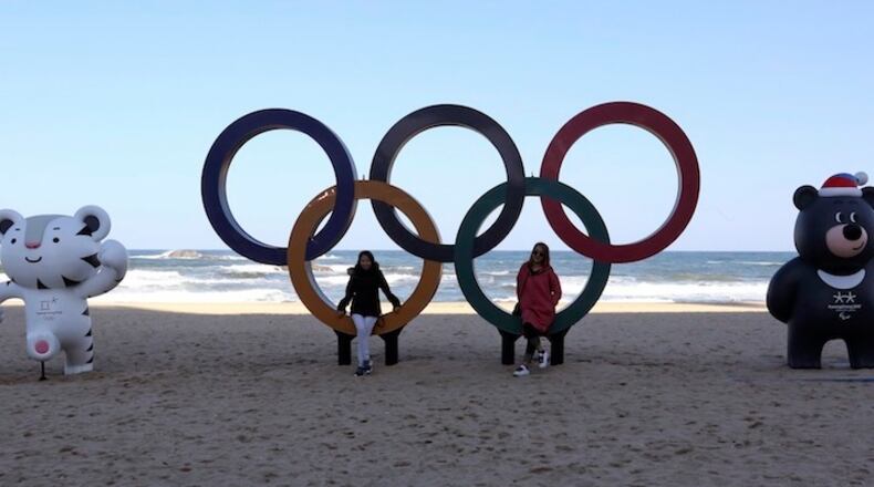 HOLD FOR USE WITH STORY SLUGGED SOUTH KOREA OLYMPIC Q&A - In this Oct. 30, 2017, file photo, the Olympic Rings, Winter Olympic Games' official mascots, white tiger Soohorang, left, for the Olympics, and black bear Bandabi for Paralympics are placed at the Gyeongpodae beach, in Gangneung, South Korea. (AP Photo/Ahn Young-joon, File)