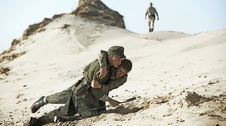 Joel Basman (from left) portrays Helmut Morbach and Louis Hofmann as Sebastian Schumann in the film “Land of Mine.” Henrik Petit/Sony Pictures Classics