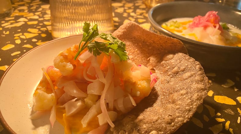 Ceviche (front) and scallop aguachile (rear) are among the seafood starters at Carmel. Ligaya Figueras/ligaya.figueras@ajc.com