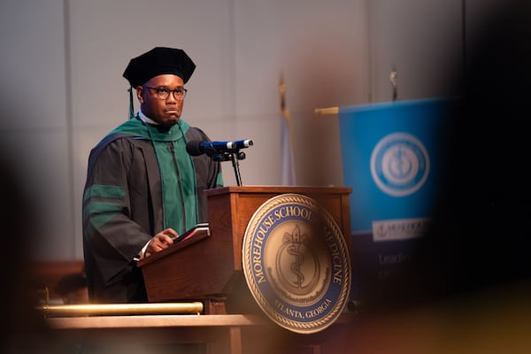 Jeromey Beaman, Morehouse School of Medicine student body president, pauses during his class remarks after acknowledging the controversy surrounding the selection of U.S. Rep. Rich McCormick to deliver the commencement address on Saturday, May 16, 2026. (Ben Gray for the AJC)